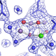 Photosystem II splitting water. The blue circles are water, purple is manganese, green is calcium, red is oxygen. The netting is electrons and the blue lines are proteins that serve as scaffolding.